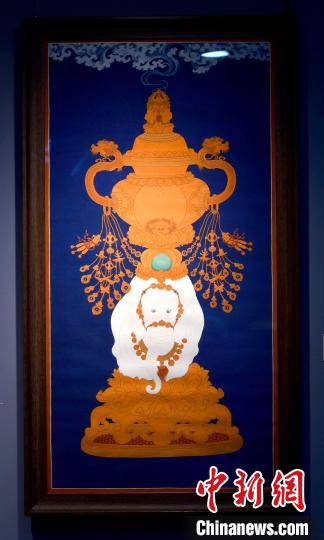 圖為5月16日，展覽中的新創(chuàng)唐卡作品《瑞象承香》?！±盍?攝